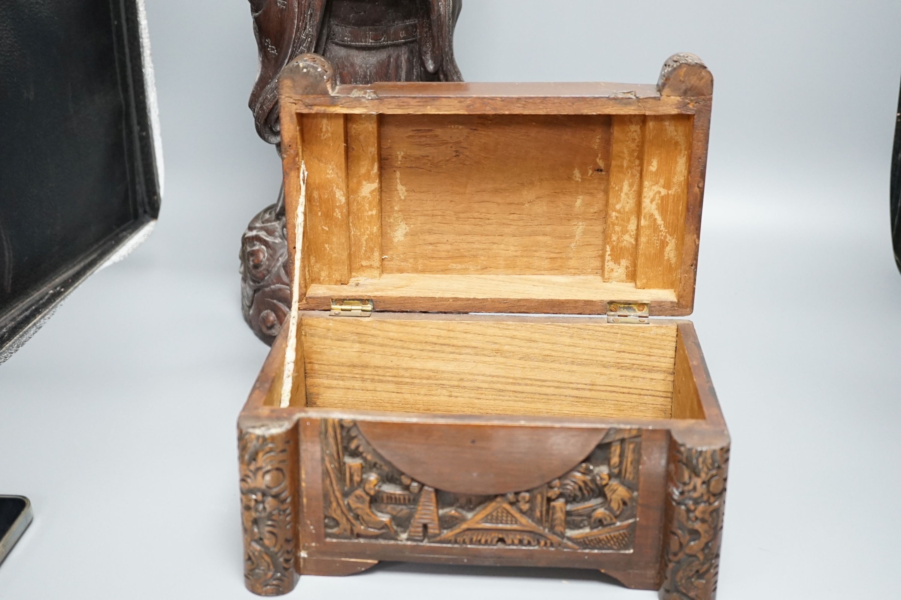 A Chinese carved wood sage and small carved trunk, Sage 47 cms high.